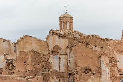 Low angle view of old building against sky