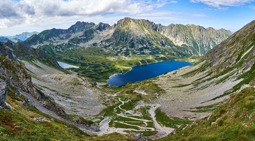 Scenic view of lake and mountains against sky