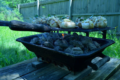 Close-up of meat on barbecue grill in yard