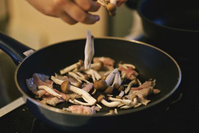 Close-up of person preparing food in kitchen