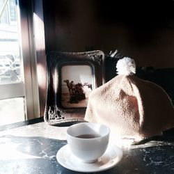 Coffee cup on table at home