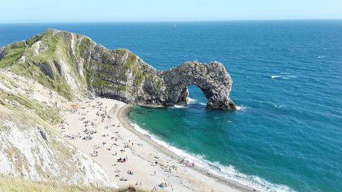 High angle view of calm beach against clear sky