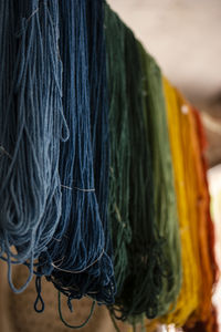 Rainbow of freshly colored threads hanging to dry