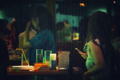 Rear view of man looking at restaurant