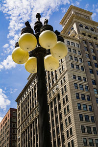 Low angle view of street light against sky