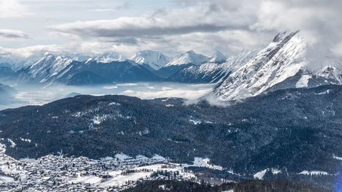 Scenic view of snowcapped mountains against sky