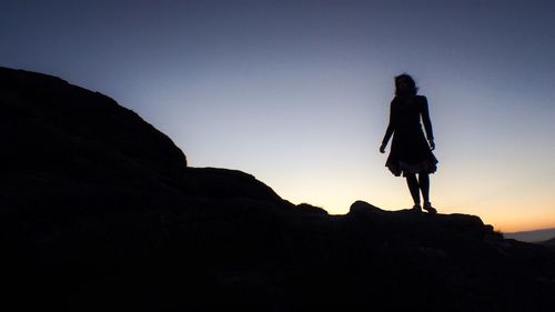 People standing on rock formation