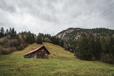 House on field against sky