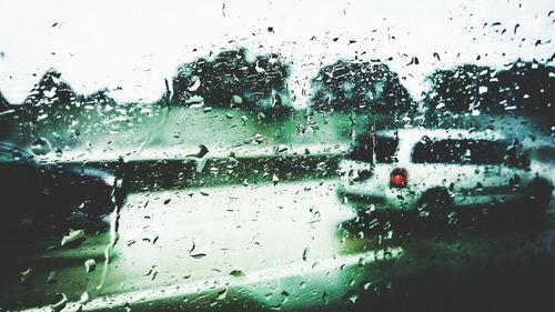 Water drops on car window in rainy season