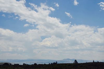 Scenic view of landscape against blue sky