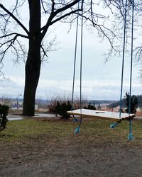 View of swing in park against sky