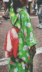 Girl wearing kimono on street during tanabata festival