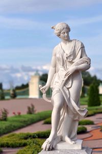 Close-up of statue in front of building