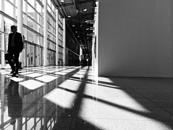 Businessman walking in corridor of building