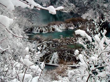 High angle view of snow on rock during winter