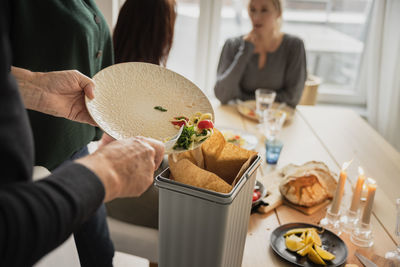 Family cleaning after having dinner