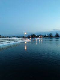 Scenic view of river against clear blue sky