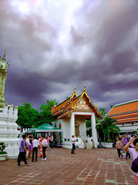 Group of people in temple against building