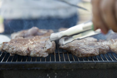 Close-up of meat on barbecue grill