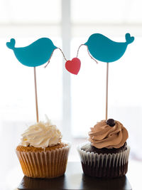 Close-up of cupcakes on cake