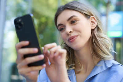 Young woman using mobile phone