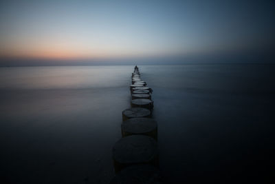 Scenic view of sea against sky at sunset