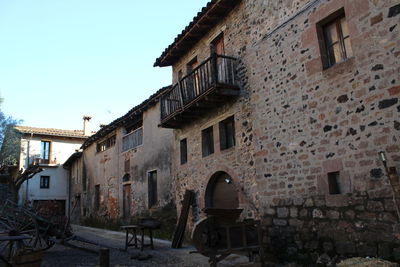 View of old buildings against sky