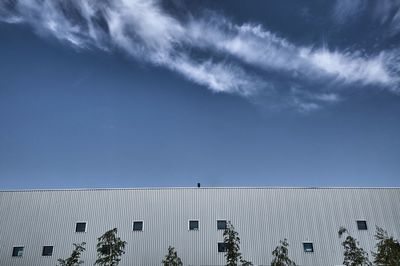 Low angle view of building against blue sky