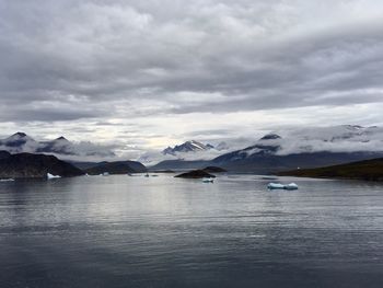 Scenic view of sea against mountains