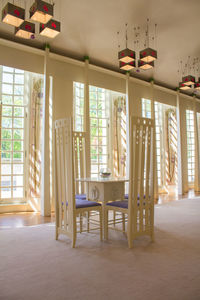 Empty chairs and tables in house mackintosh glasgow house for an art lover