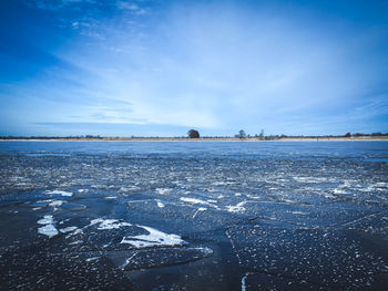 Scenic view of sea against sky during winter