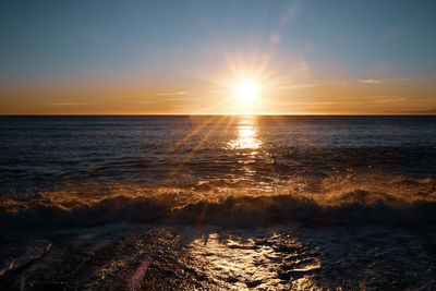 Scenic view of sea against sky during sunset