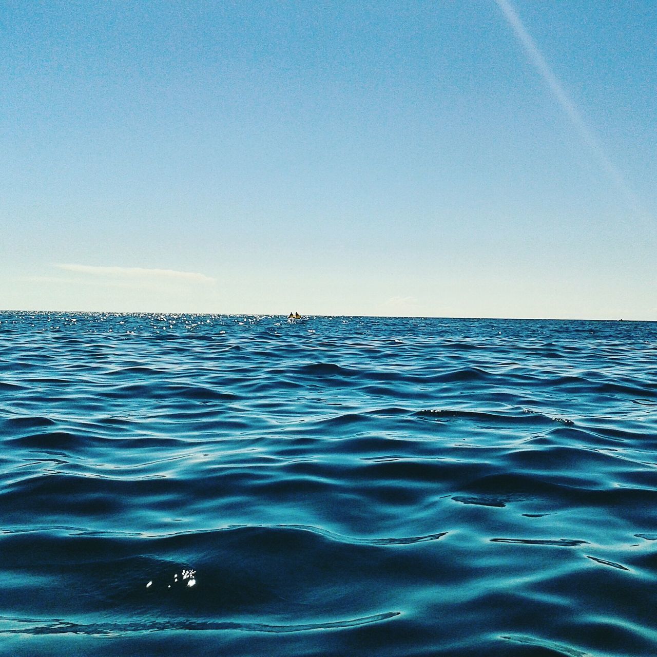 water, sea, waterfront, tranquil scene, blue, scenics, tranquility, beauty in nature, rippled, clear sky, horizon over water, nature, copy space, idyllic, seascape, sky, outdoors, day, remote, no people