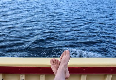 Low section of man on boat in sea