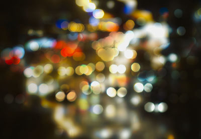 Defocused image of illuminated lights at night