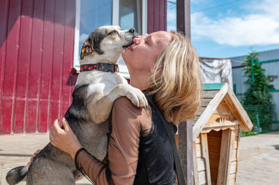 Rear view of woman with dog