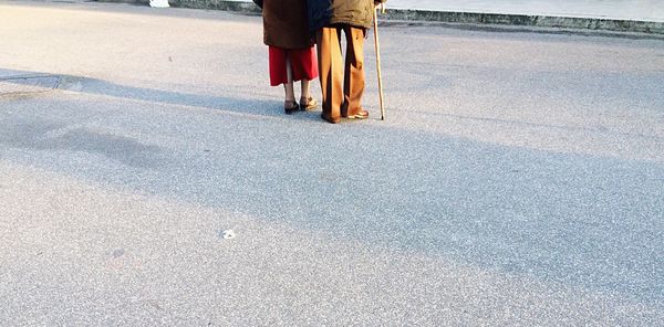 Low section of people standing on ground