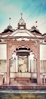 Statue of historic building against sky