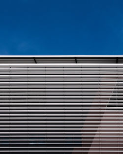 Low angle view of building against blue sky