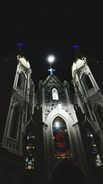 Low angle view of statue at night