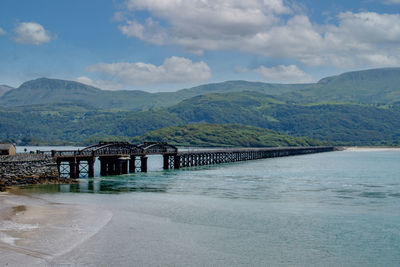 Bridge over river against sky