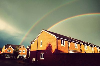 Rainbow over buildings