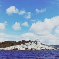 Scenic view of sea against cloudy sky