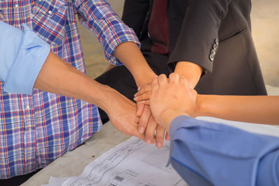 High angle view of people hands