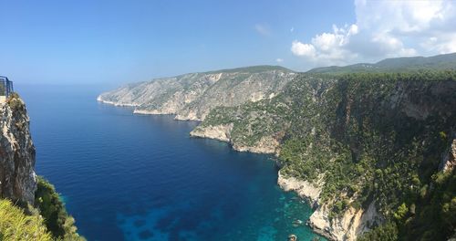 Panoramic view of sea and mountains against sky