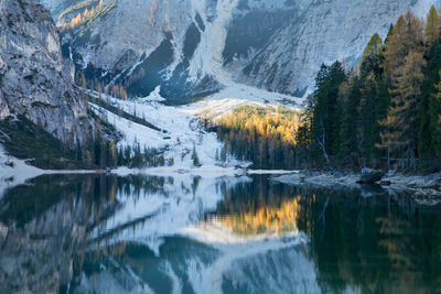 Scenic view of lake and mountains during winter