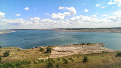 Scenic view of landscape against cloudy sky