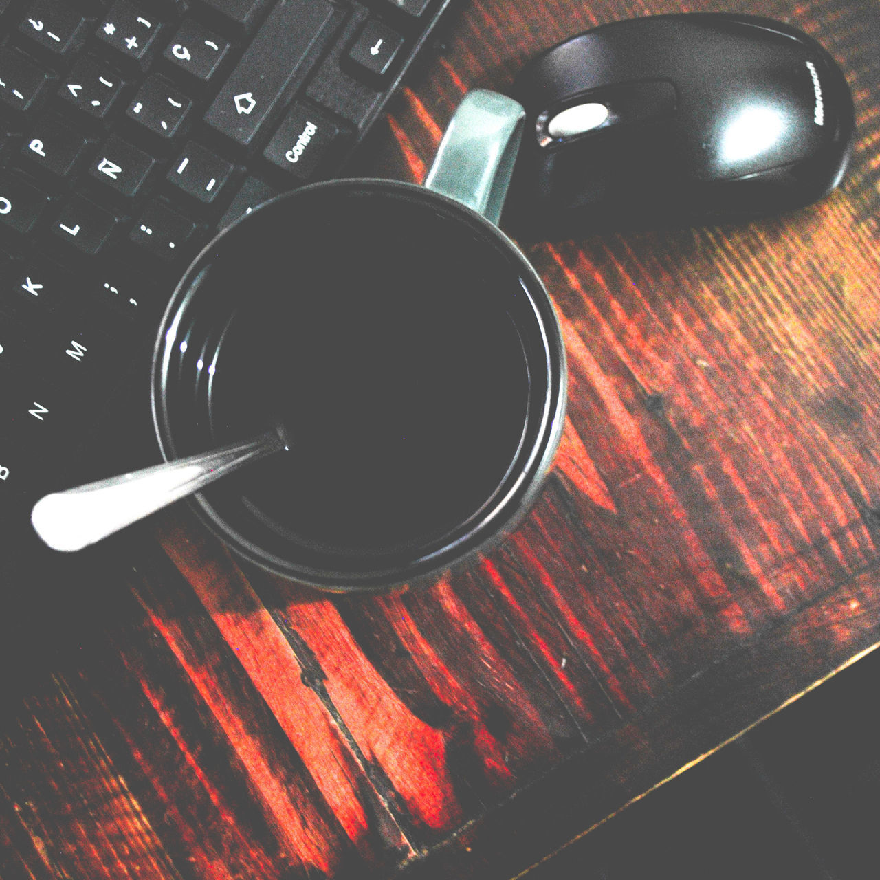 HIGH ANGLE VIEW OF BLACK COFFEE ON TABLE AT HOME