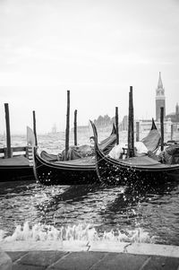 Boats moored in sea