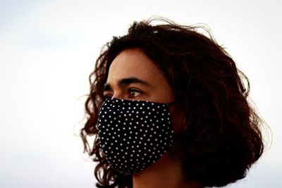 Portrait of beautiful woman against white background